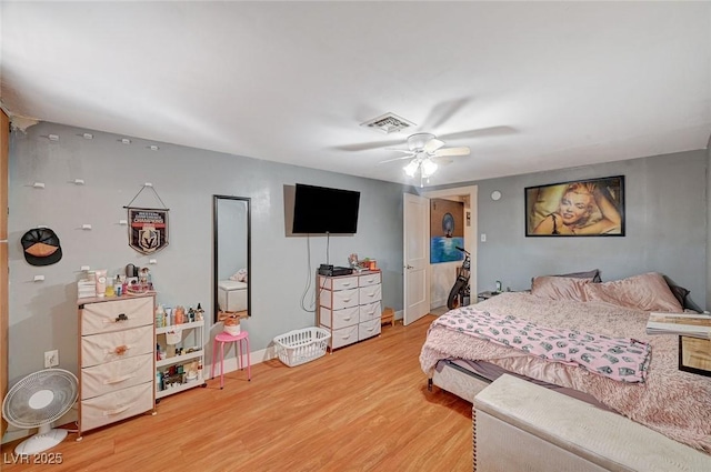 bedroom with wood-type flooring and ceiling fan