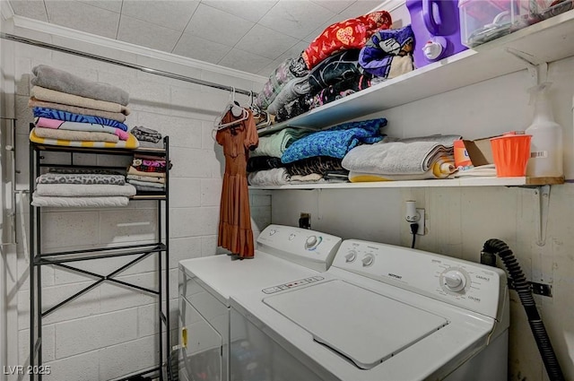 632 D, Boulder City, NV 89005 - washroom featuring concrete block wall, washing machine and dryer, and ornamental molding