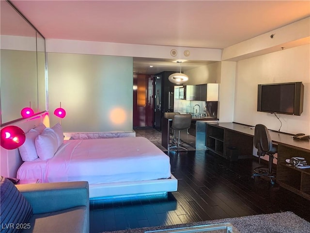 bedroom featuring dark hardwood / wood-style floors