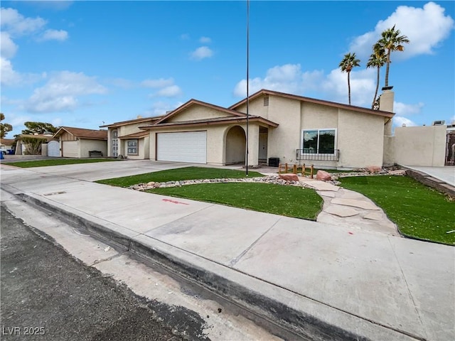 ranch-style home with a garage and a front yard