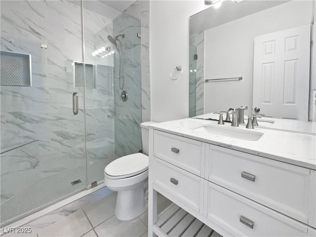 bathroom with vanity, toilet, and a shower with door