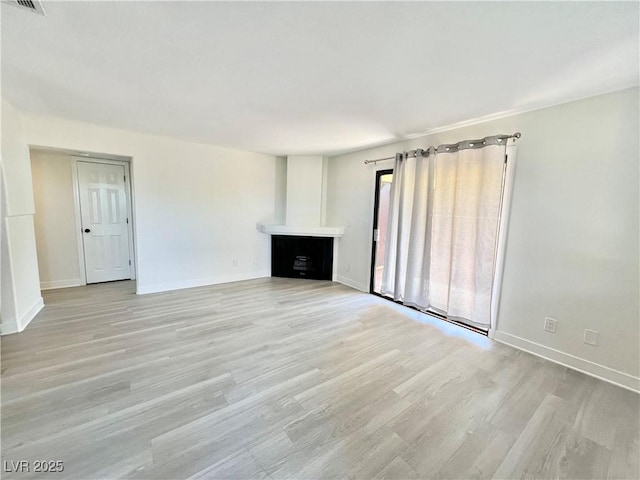 unfurnished living room featuring light hardwood / wood-style flooring