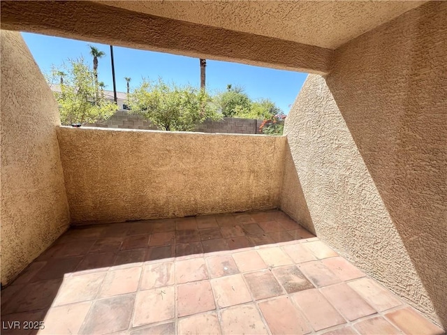 view of patio featuring a balcony