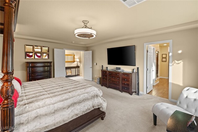 bedroom with visible vents, light colored carpet, and baseboards