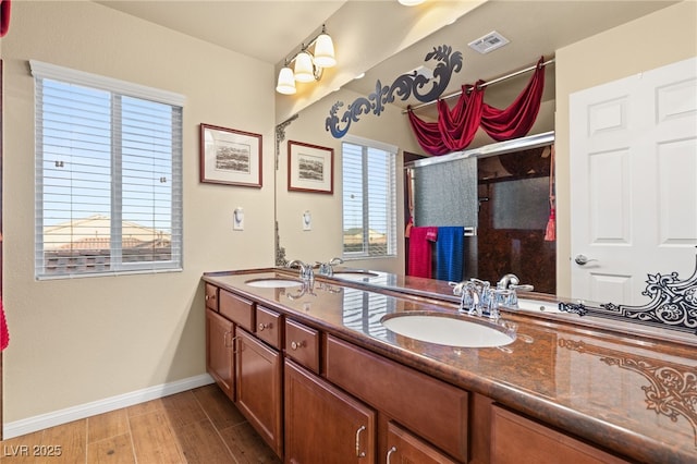 bathroom featuring vanity and hardwood / wood-style floors