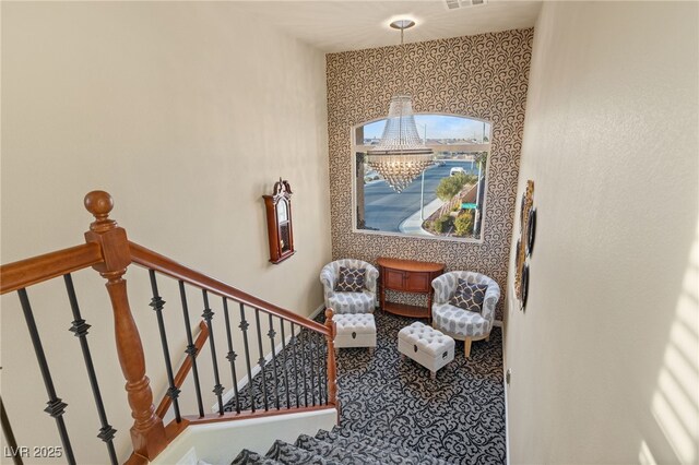 stairway with an inviting chandelier