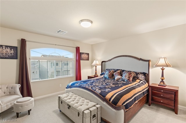 bedroom with light colored carpet