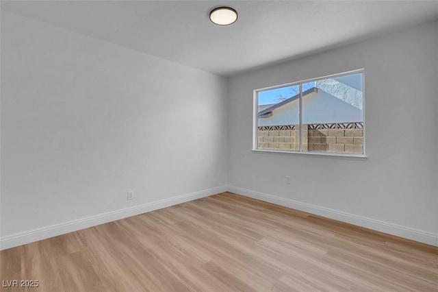 unfurnished room with light hardwood / wood-style floors