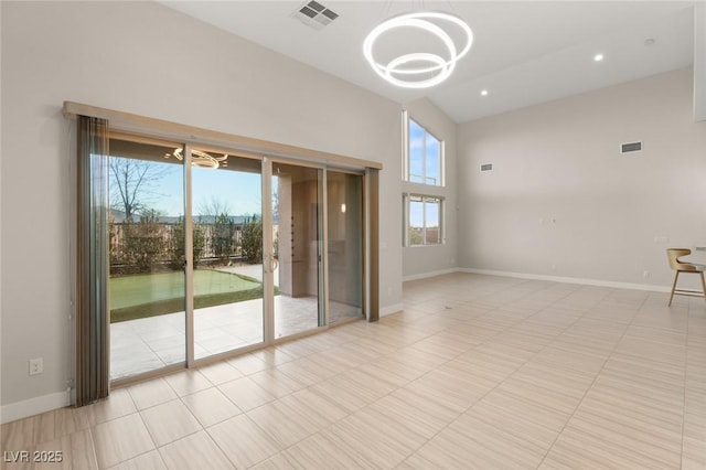 unfurnished room featuring light tile patterned floors, a notable chandelier, and high vaulted ceiling