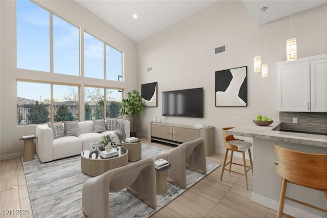 living room with a high ceiling