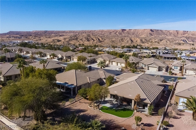 birds eye view of property with a mountain view