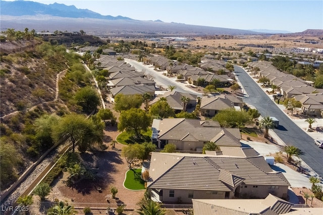 birds eye view of property with a mountain view