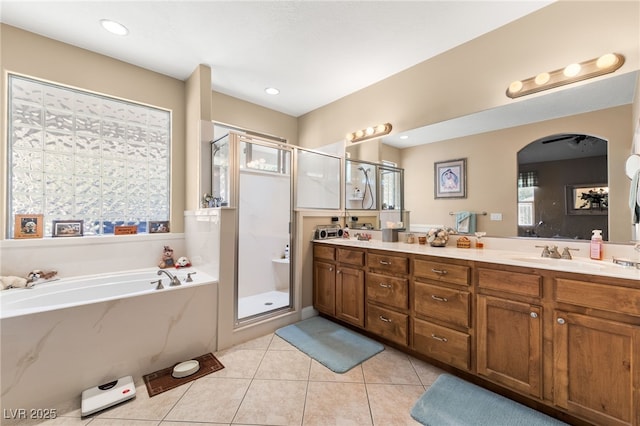 bathroom with vanity, separate shower and tub, and tile patterned flooring