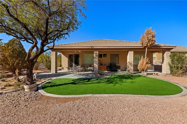 back of house with a patio