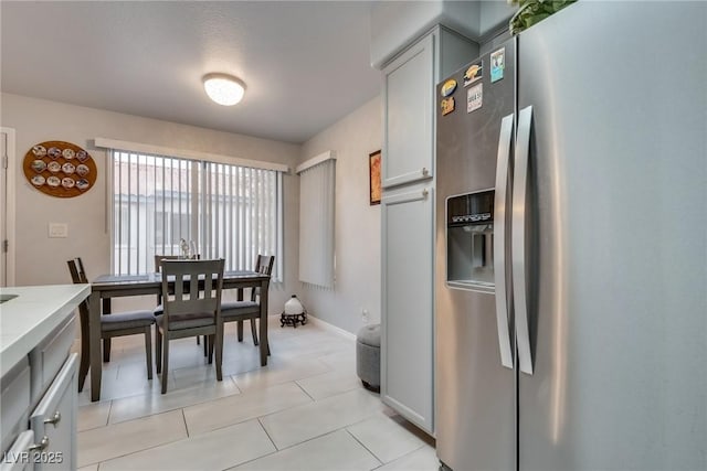 dining space with light tile patterned floors