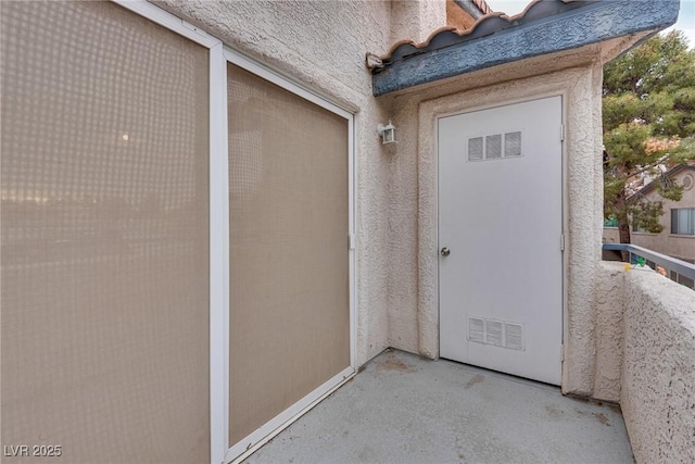 doorway to property featuring a balcony