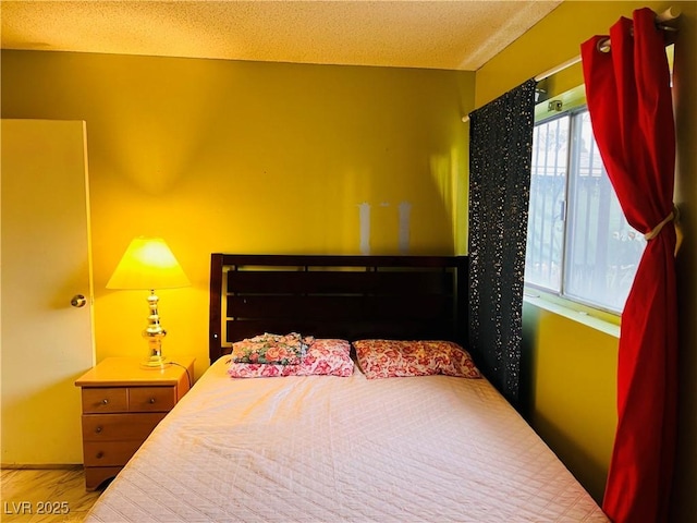 bedroom featuring a textured ceiling