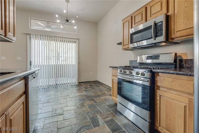 kitchen with a notable chandelier, decorative light fixtures, and appliances with stainless steel finishes