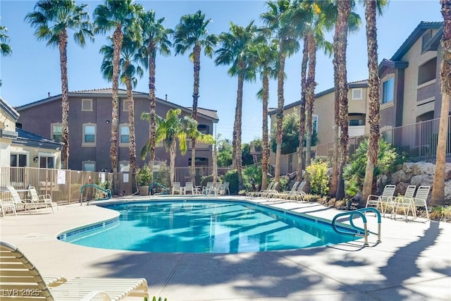 view of swimming pool with a patio