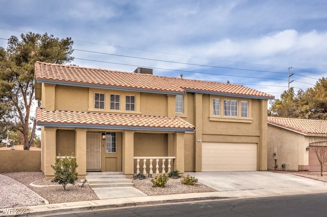 mediterranean / spanish-style home featuring a garage