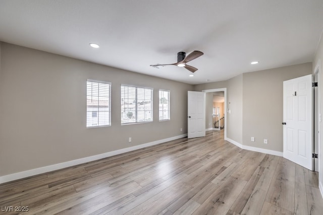 unfurnished bedroom featuring ceiling fan and light hardwood / wood-style flooring