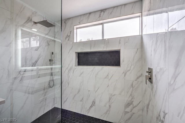 bathroom with a tile shower