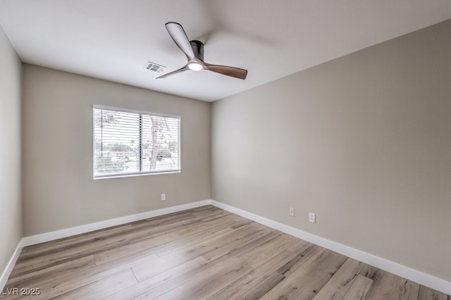 spare room with ceiling fan and light hardwood / wood-style floors