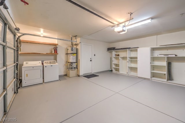 garage with a garage door opener, washing machine and dryer, and water heater