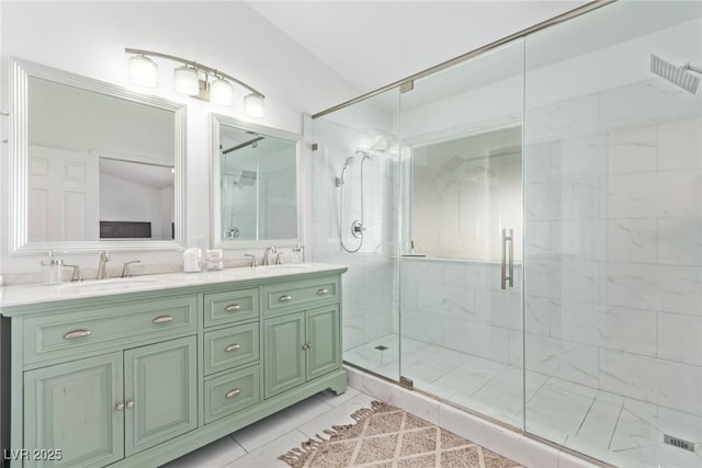 bathroom with vanity, tile patterned floors, vaulted ceiling, and a shower with door