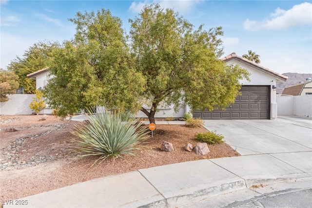 obstructed view of property featuring a garage