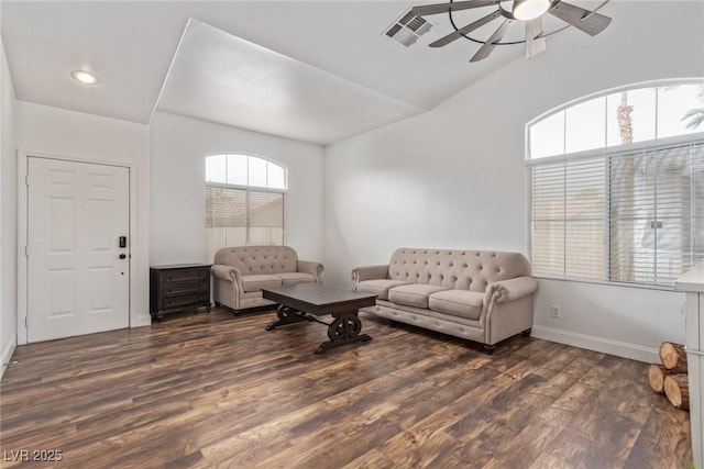 living room with dark hardwood / wood-style flooring, vaulted ceiling, and ceiling fan