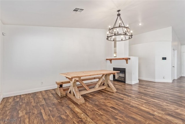 dining space with dark wood-type flooring