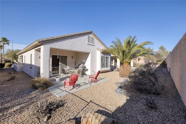 back of house featuring a patio