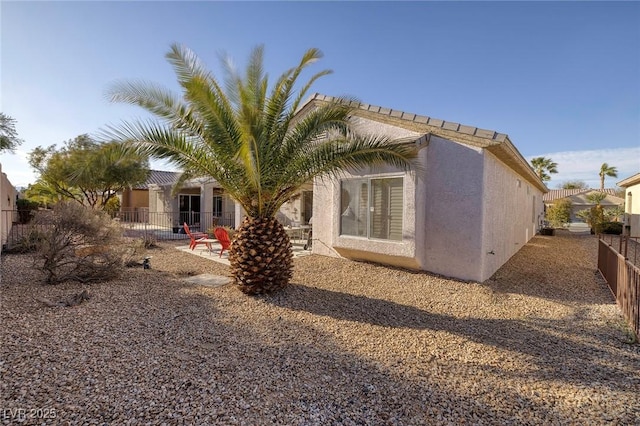 rear view of house featuring a patio area