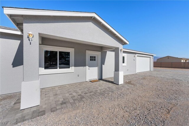 rear view of property featuring a patio area