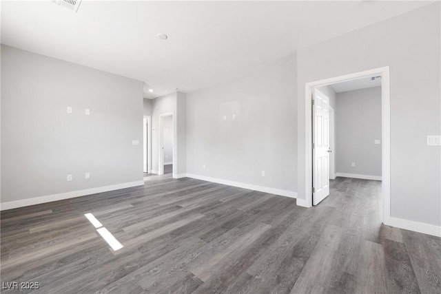 empty room with dark wood-type flooring