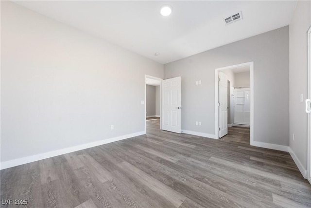 unfurnished bedroom featuring hardwood / wood-style flooring