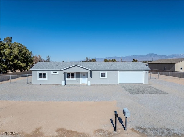 ranch-style house with a mountain view and a garage