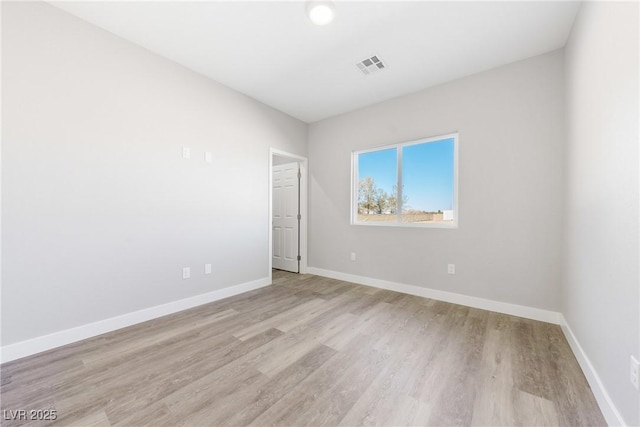 empty room with light wood-type flooring