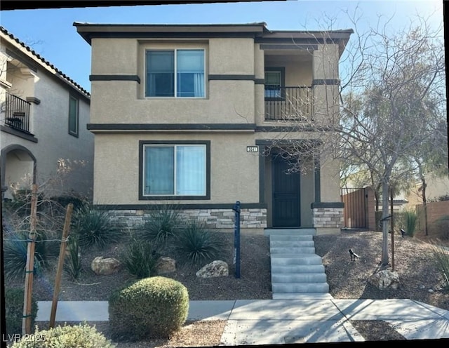 view of front property with a balcony