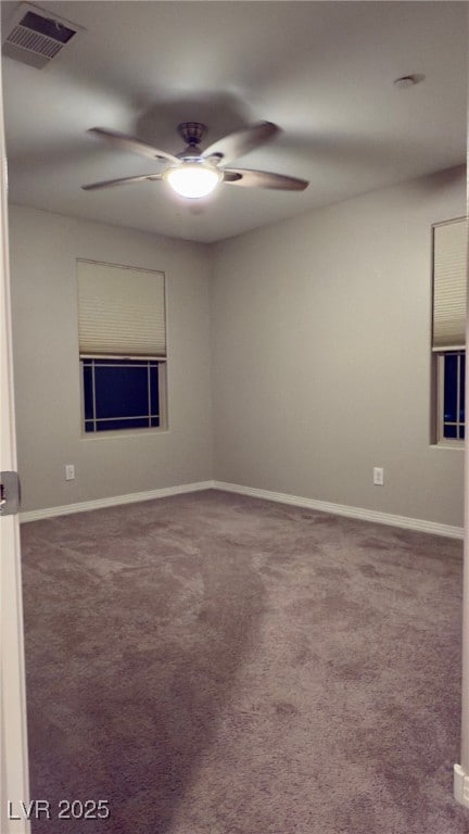 empty room featuring carpet and ceiling fan