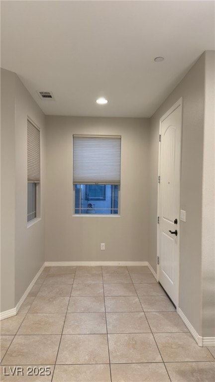 spare room with light tile patterned floors