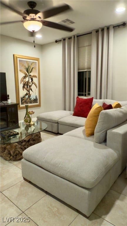 living room featuring tile patterned floors and ceiling fan