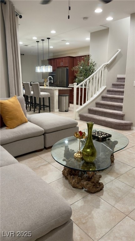 tiled living room featuring sink