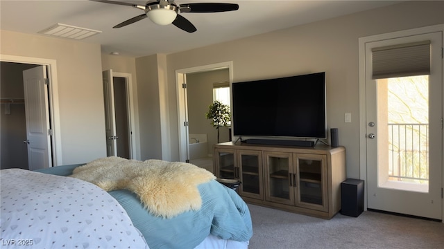 carpeted bedroom with multiple windows and ceiling fan