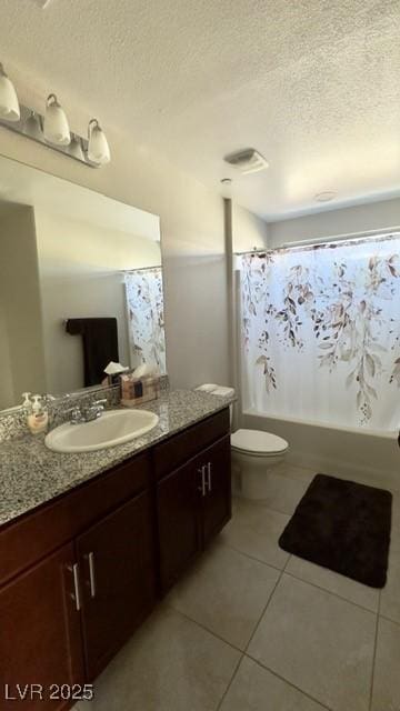 full bathroom featuring tile patterned flooring, vanity, toilet, shower / bath combo, and a textured ceiling