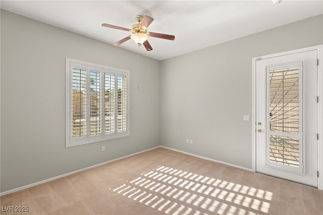 carpeted empty room with ceiling fan