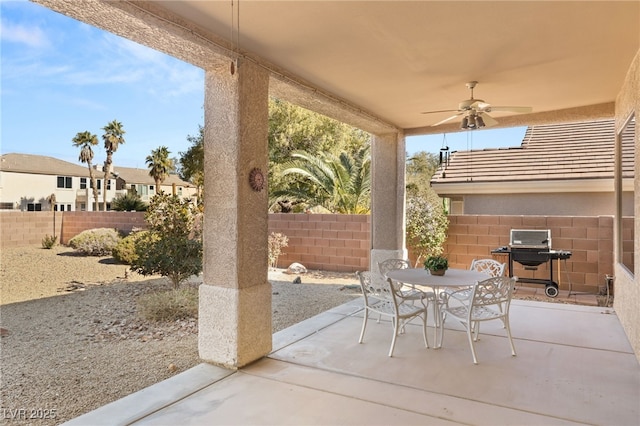 view of patio with a grill and ceiling fan