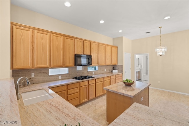 kitchen with tasteful backsplash, sink, black appliances, and light stone countertops