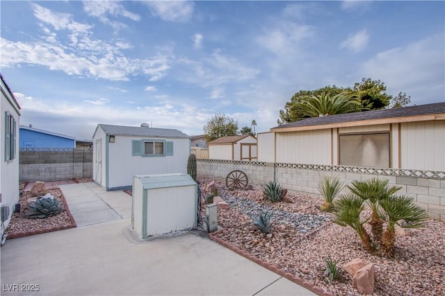 view of front of home featuring an outdoor structure and a patio